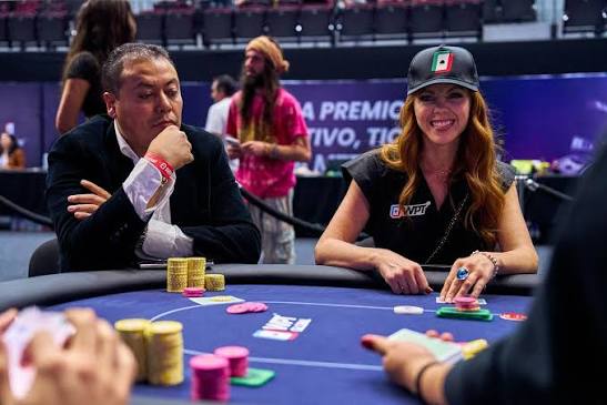 smiling woman playing poker at a pro table